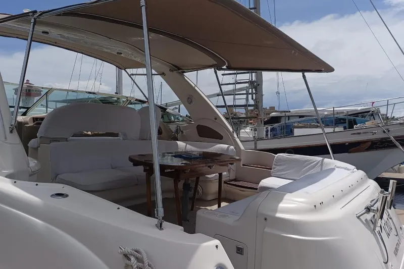2000 Sea Ray 460 Sundancer @ Ixtapa Yacht Photos Pics 2000 Sea Ray 460 Sundancer yacht with spacious seating and canopy in marina.
