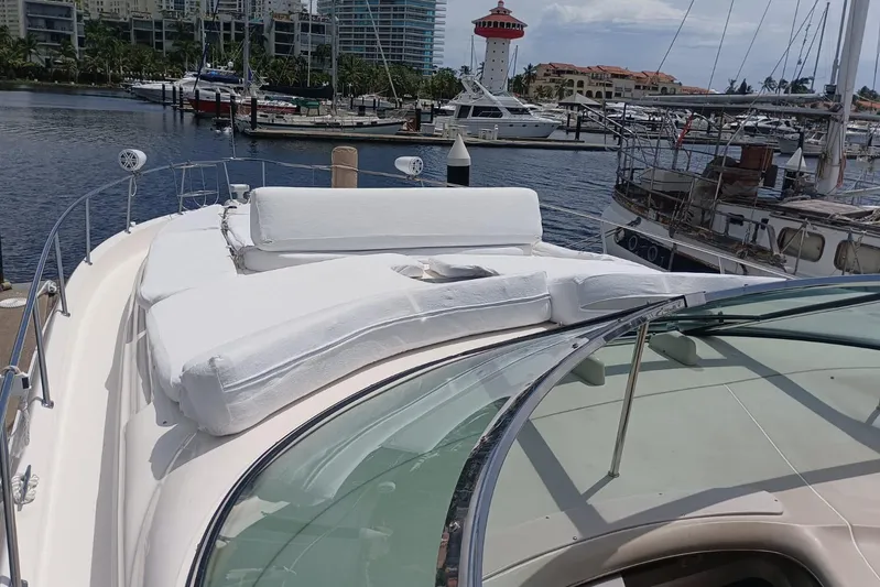 2000 Sea Ray 460 Sundancer @ Ixtapa Yacht Photos Pics 2000 Sea Ray 460 Sundancer yacht with white deck cushions in a marina setting.