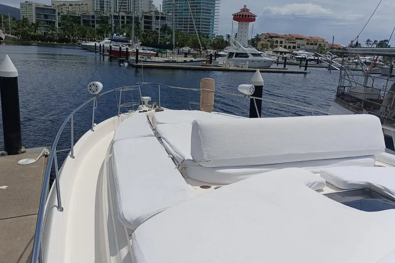 2000 Sea Ray 460 Sundancer @ Ixtapa Yacht Photos Pics 2000 Sea Ray 460 Sundancer yacht docked in marina with scenic waterfront view.