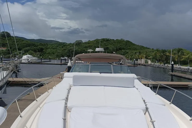 2000 Sea Ray 460 Sundancer @ Ixtapa Yacht Photos Pics 2000 Sea Ray 460 Sundancer yacht docked in a scenic marina with lush greenery.