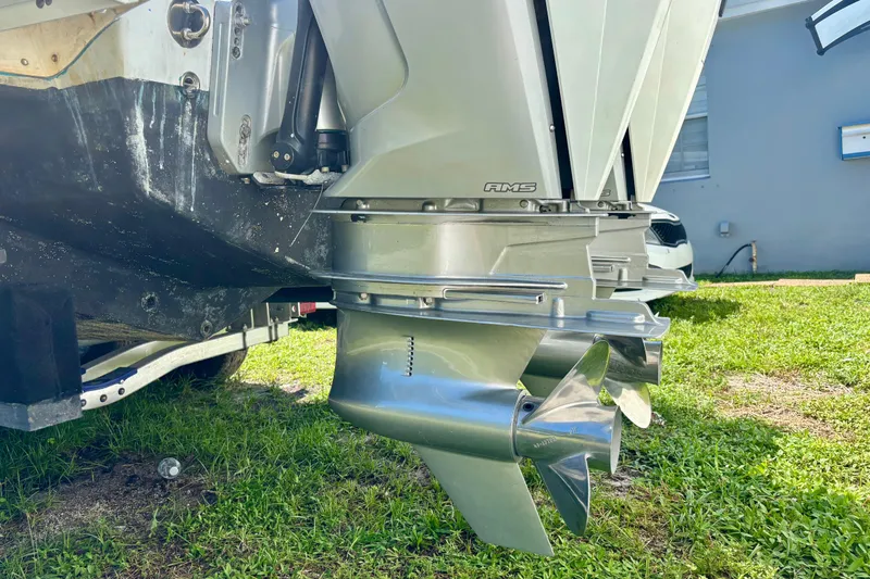  Yacht Photos Pics 2008 Intrepid 327 Center Console boat with dual outboard motors on grass.