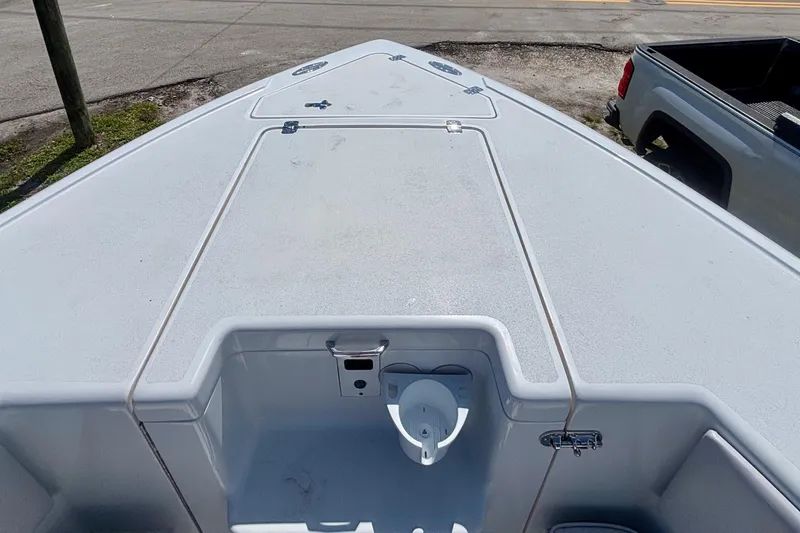  Yacht Photos Pics 2008 Intrepid 327 Center Console boat deck, featuring storage compartments and clean design.