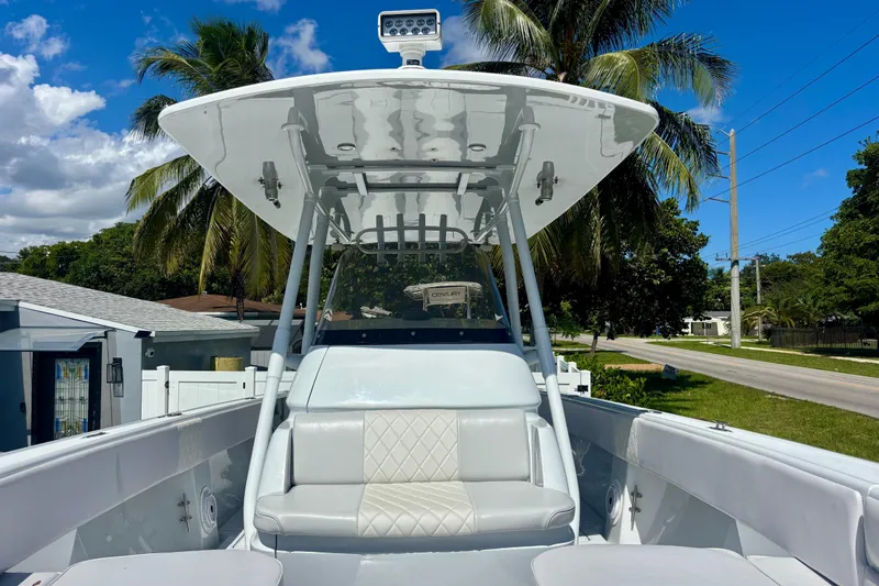  Yacht Photos Pics 2008 Intrepid 327 Center Console boat with seating, under a clear blue sky.