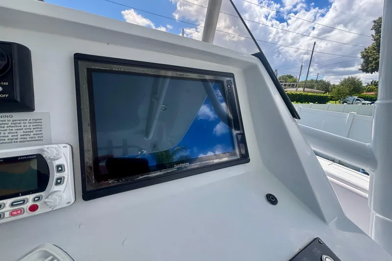  Yacht Photos Pics 2008 Intrepid 327 Center Console dashboard with Garmin GPS and Explorer VHF radio.