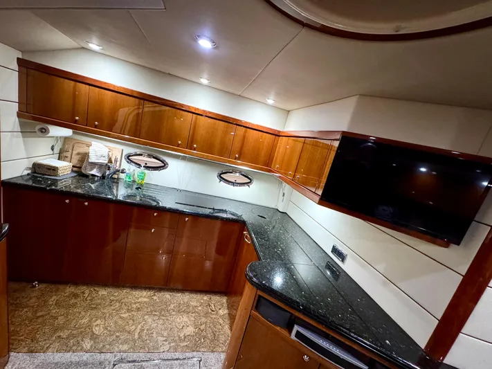Motivation Yacht Photos Pics Galley w/ High Gloss Cherry Wood Interior