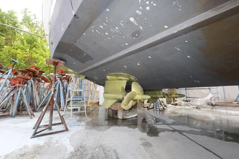  Yacht Photos Pics 2014 Sunseeker San Remo yacht under maintenance, showing propellers and supports.