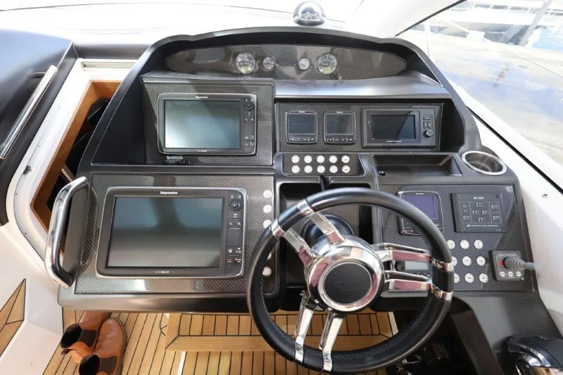 Yacht Photos Pics Sunseeker San Remo 2014 yacht helm with advanced navigation controls and sleek design.