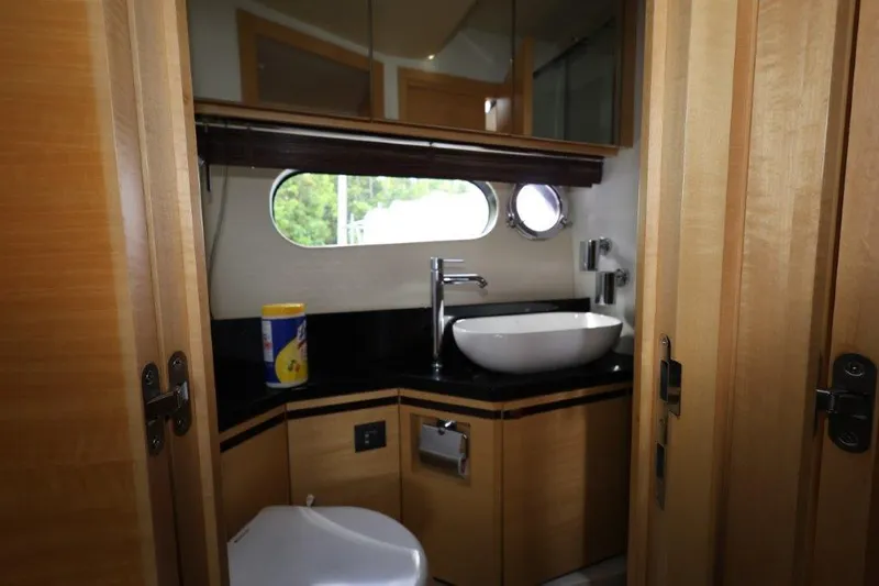  Yacht Photos Pics Luxurious 2014 Sunseeker San Remo yacht bathroom with modern fixtures and wood accents.