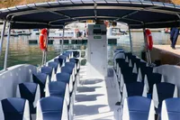 2025 Olbap TR12 Open boat with seating, docked at marina.