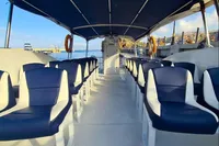 Interior of 2025 Olbap TR12 Open boat with blue and white seating.