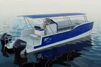 2025 Olbap TR12 Open boat with dual Mercury engines on calm water.