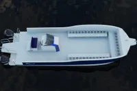 2025 Olbap TR12 Open boat, aerial view, featuring dual outboard motors and spacious seating.