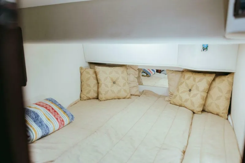 The Green Squirrel Yacht Photos Pics Cozy cabin interior of 2010 Sea Ray 390 Sedan Bridge with decorative pillows.