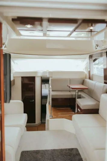 The Green Squirrel Yacht Photos Pics Interior of 2010 Sea Ray 390 Sedan Bridge yacht with elegant seating and dining area.