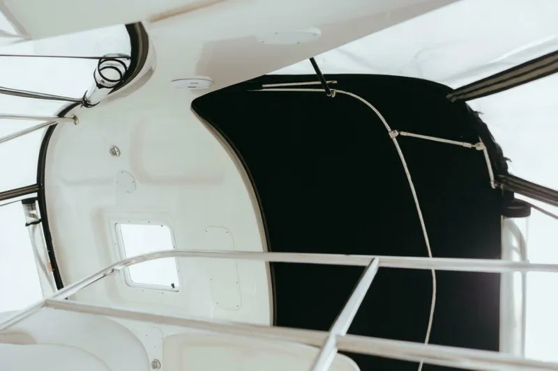 The Green Squirrel Yacht Photos Pics 2010 Sea Ray 390 Sedan Bridge interior ceiling view with black canopy.