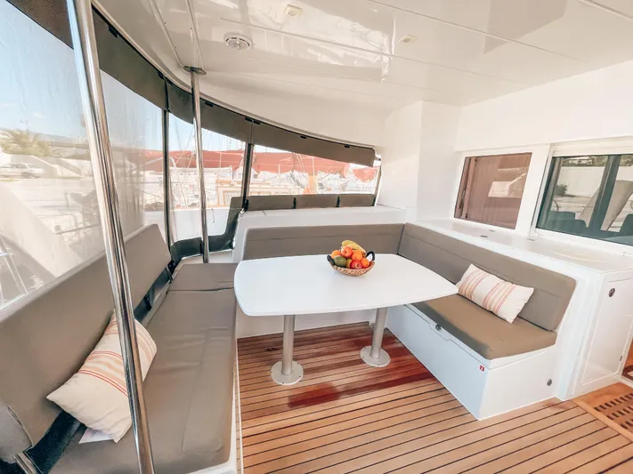  Yacht Photos Pics Luxurious 2019 Lagoon 450 s yacht interior with cozy seating and fruit centerpiece.