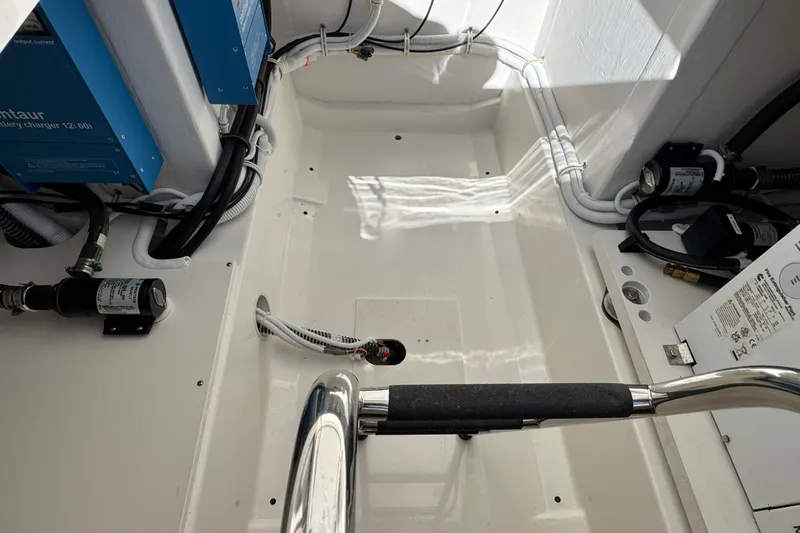  Yacht Photos Pics Engine compartment of 2025 Tiara Yachts 38 LS, showcasing wiring and components.
