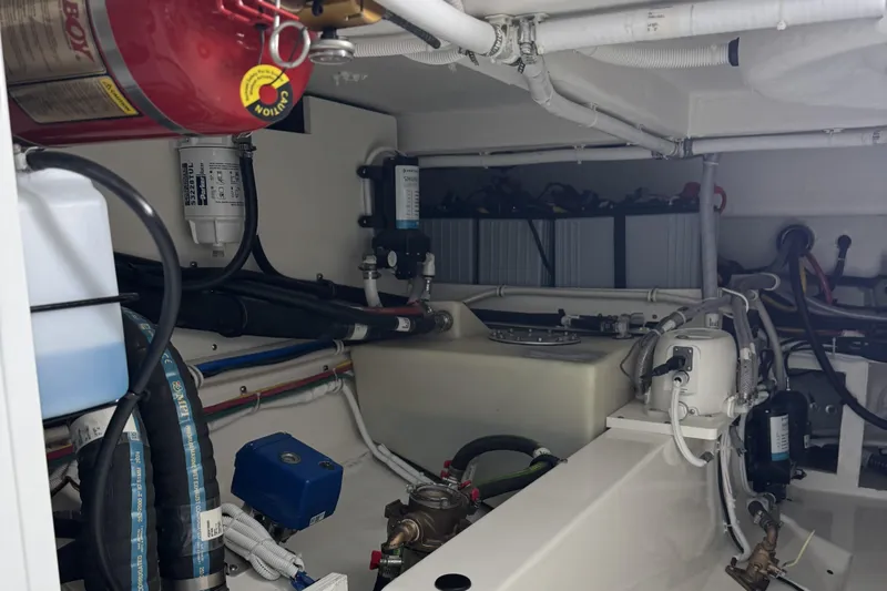  Yacht Photos Pics Engine room of 2025 Tiara Yachts 38 LS, showcasing mechanical components and systems.