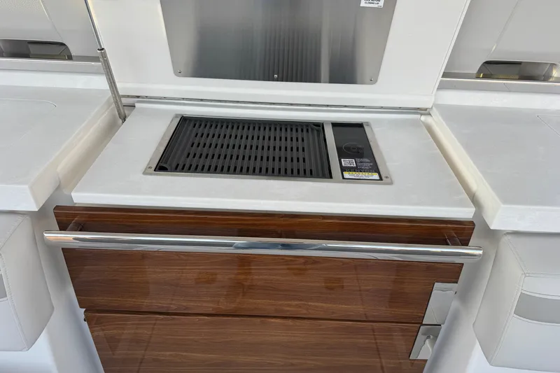  Yacht Photos Pics Outdoor grill station on 2025 Tiara Yachts 38 LS, featuring sleek design and modern amenities.