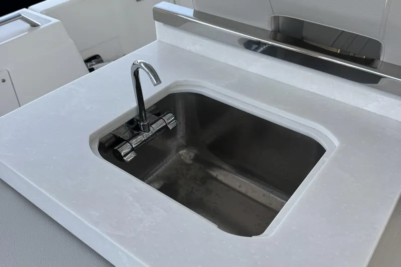  Yacht Photos Pics Stainless steel sink on 2025 Tiara Yachts 38 LS boat, featuring modern faucet design.