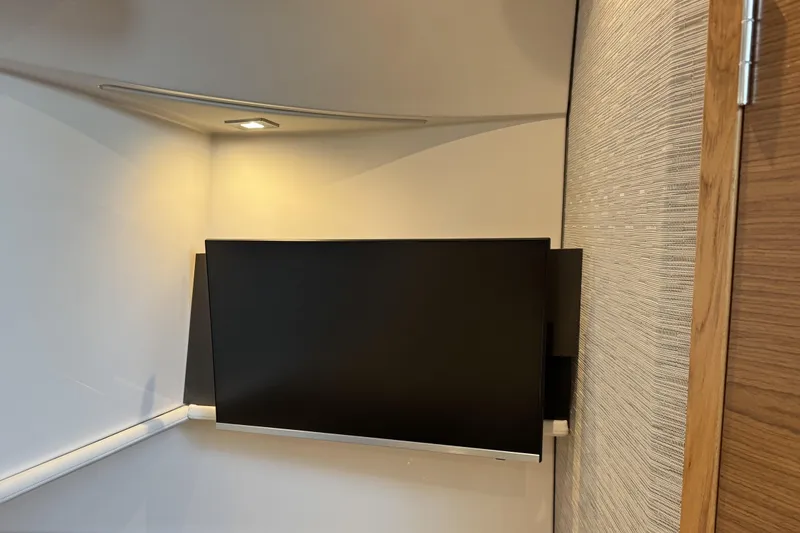  Yacht Photos Pics Modern interior of 2025 Tiara Yachts 38 LS with wall-mounted TV.