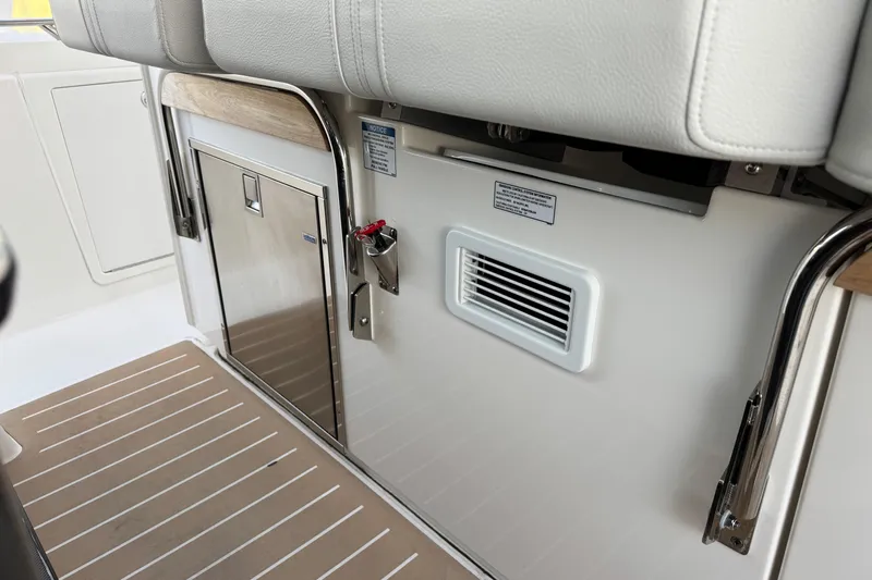  Yacht Photos Pics Interior view of 2025 Tiara Yachts 38 LS, featuring sleek seating and storage.