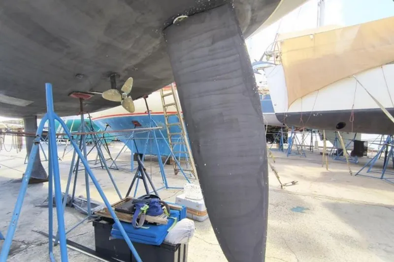 Unbound Yacht Photos Pics Beneteau First 47.7 sailboat under maintenance, showcasing propeller and keel, 2001 model.