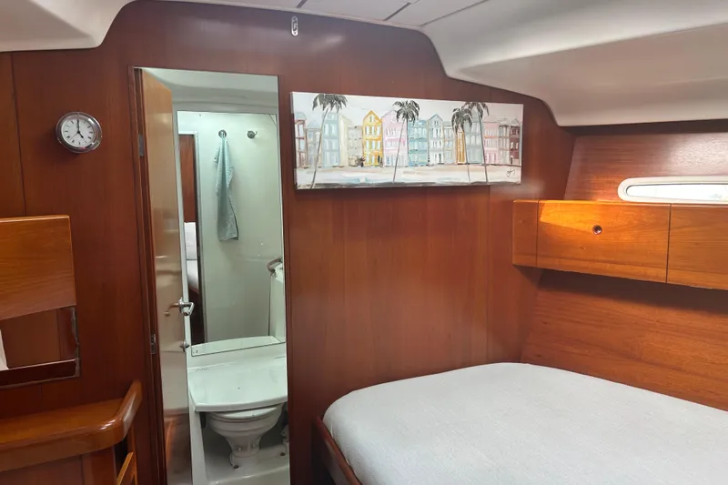 Unbound Yacht Photos Pics Cozy cabin interior of 2001 Beneteau First 47.7 yacht with ensuite bathroom.