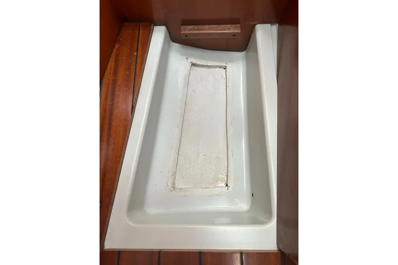 Unbound Yacht Photos Pics Interior view of a 2001 Beneteau First 47.7 sailboat, featuring a wooden and fiberglass floor.