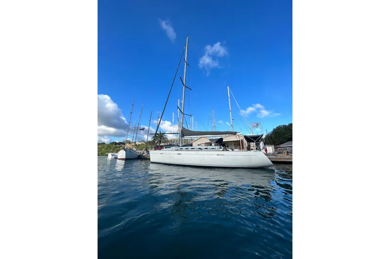 Unbound Yacht Photos Pics Sailboat Beneteau First 47.7, 2001 model, docked under clear blue sky.