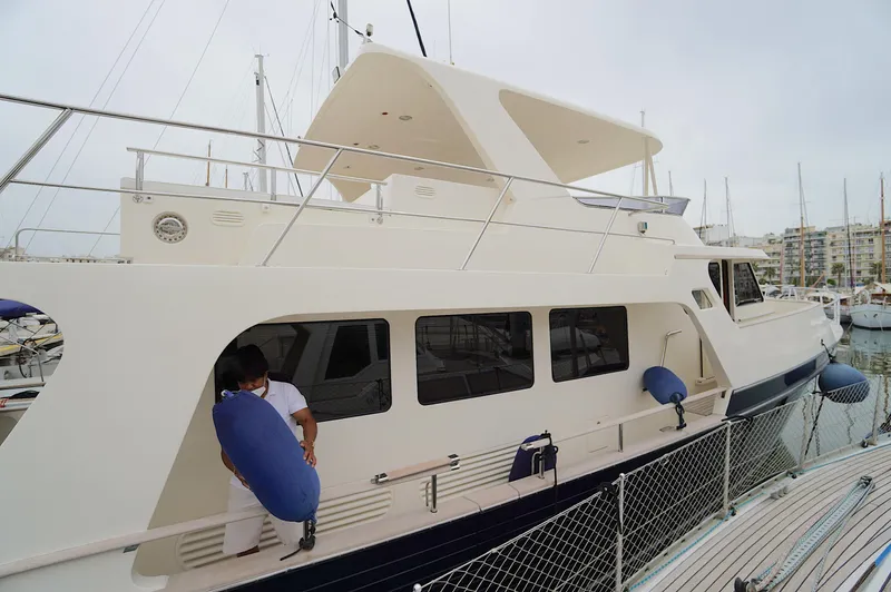 Defly Yacht Photos Pics Luxury Marlow 61E yacht docked at marina, 2009 model.