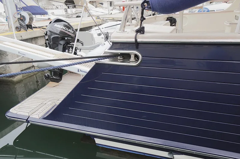 Defly Yacht Photos Pics Sleek 2009 Marlow 61E yacht with Mercury outboard motor at marina.