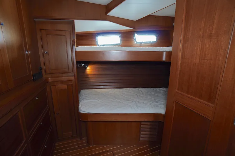 Defly Yacht Photos Pics Wooden interior cabin with bunk beds in 2009 Marlow 61E yacht.