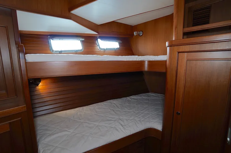 Defly Yacht Photos Pics Wooden bunk beds in a 2009 Marlow 61E yacht cabin.