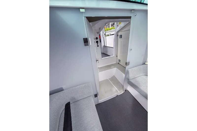  Yacht Photos Pics Interior of 2023 Axopar 37 XC Cross Cabin, featuring modern seating and sleek design.