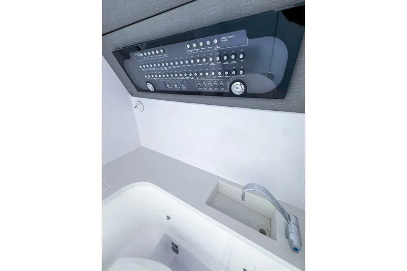  Yacht Photos Pics 2023 Axopar 37 XC Cross Cabin interior control panel and sink detail.
