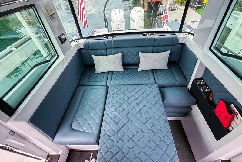  Yacht Photos Pics Luxurious interior of 2023 Axopar 37 XC Cross Cabin with quilted seating and cushions.