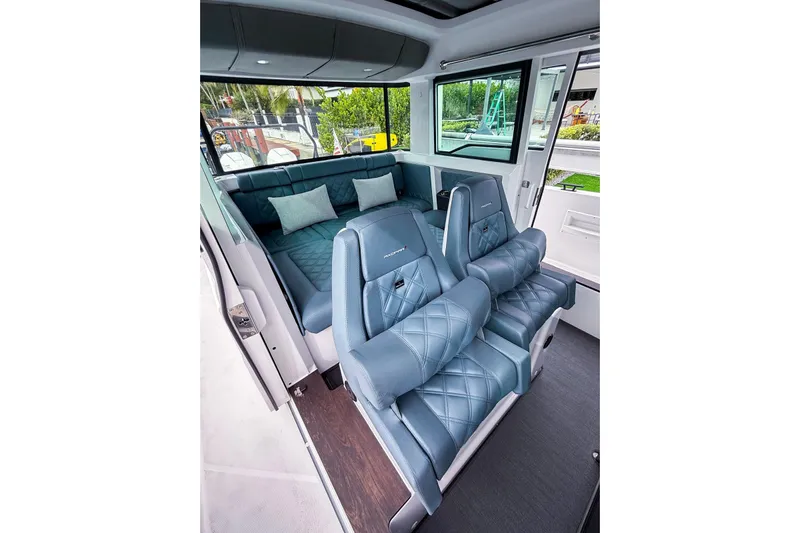  Yacht Photos Pics Luxurious interior of 2023 Axopar 37 XC Cross Cabin with plush seating and modern design.