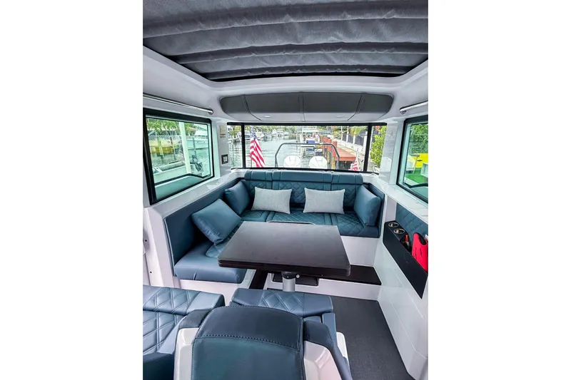  Yacht Photos Pics Luxurious interior of 2023 Axopar 37 XC Cross Cabin with plush seating and modern design.
