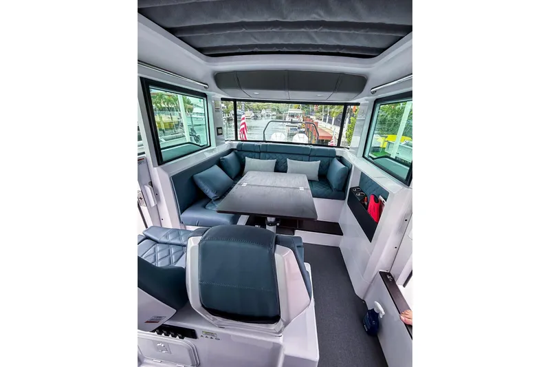  Yacht Photos Pics Luxurious interior of 2023 Axopar 37 XC Cross Cabin with plush seating and modern design.