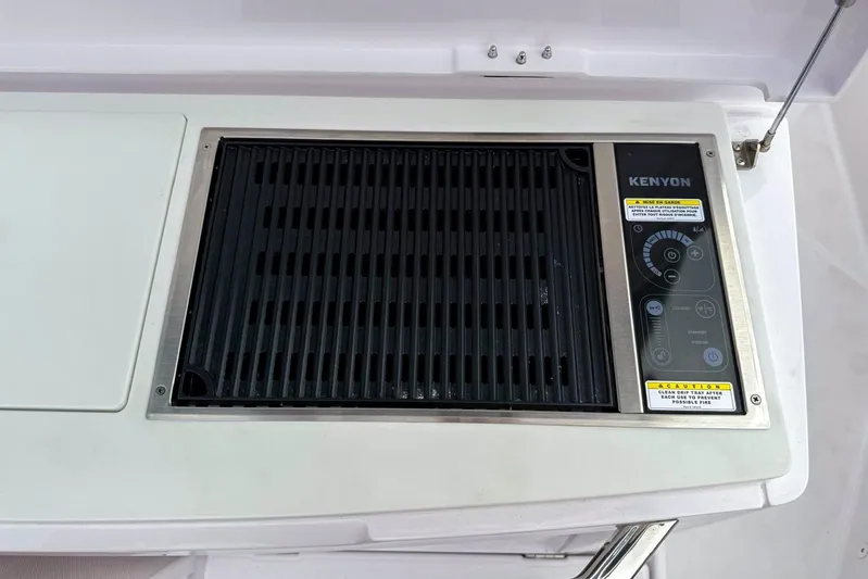  Yacht Photos Pics Kenyon grill on 2023 Axopar 37 XC Cross Cabin boat, featuring control panel.