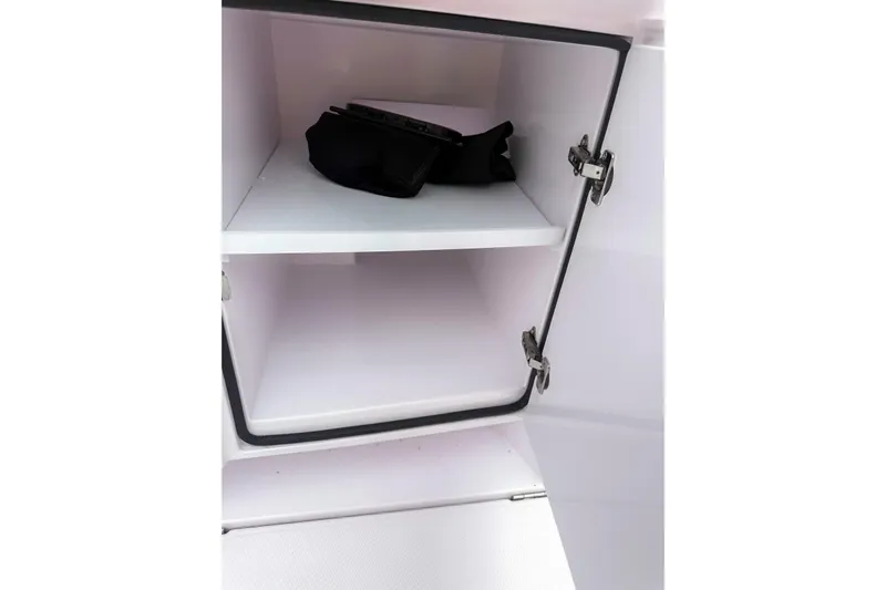  Yacht Photos Pics Open storage compartment in 2023 Axopar 37 XC Cross Cabin boat.