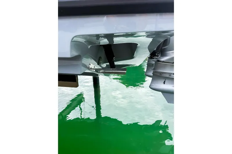  Yacht Photos Pics 2023 Axopar 37 XC Cross Cabin boat engine detail on green water.