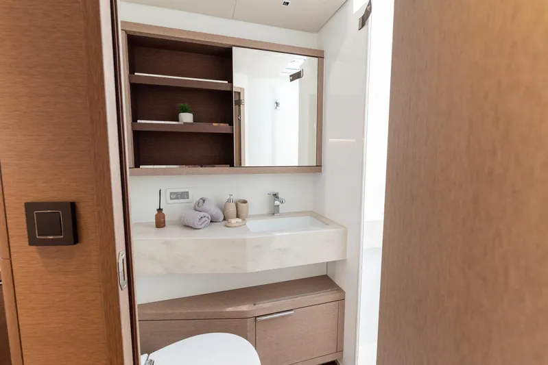  Yacht Photos Pics Luxurious bathroom interior of 2024 Lagoon SIXTY 5 yacht with modern fixtures.