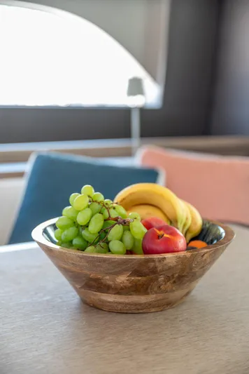  Yacht Photos Pics Bowl of fresh fruit on a table inside a 2024 Lagoon SIXTY 5 yacht.