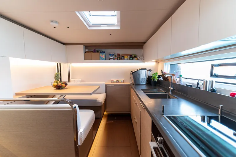  Yacht Photos Pics Modern kitchen interior of 2024 Lagoon SIXTY 5 yacht with sleek design and ample lighting.