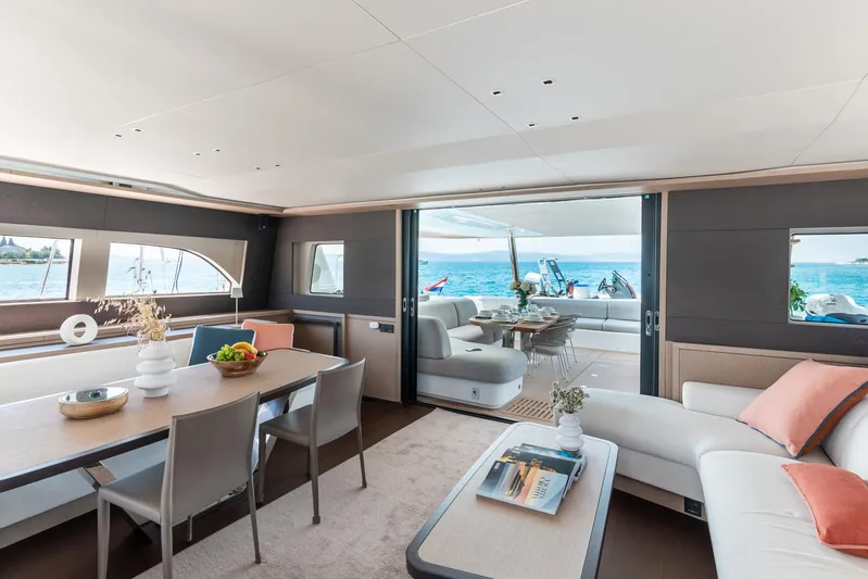  Yacht Photos Pics Luxurious interior of 2024 Lagoon SIXTY 5 yacht with ocean view and elegant furnishings.
