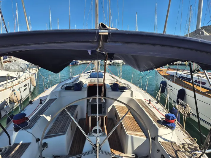 Princess Yacht Photos Pics Grand Soleil 45 sailboat cockpit, 2008 model, docked in marina with clear blue sky.