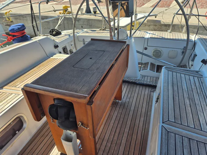 Princess Yacht Photos Pics 2008 Grand Soleil 45 yacht cockpit with wooden table and seating.