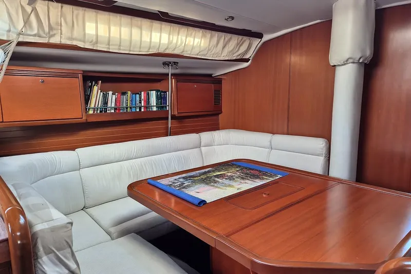 Princess Yacht Photos Pics Luxurious interior of 2008 Grand Soleil 45 yacht with wooden finish and cozy seating.